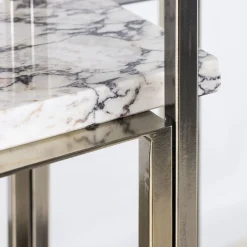 Libreria Colonna in metallo dorato con ripiani in marmo*Nobe Italia