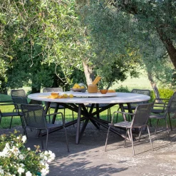 Tavolo da pranzo rotondo in pietra travertino e acciaio marrone per esterni Hermu 230*Veltha Outdoor Stone Design New