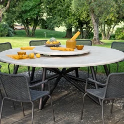 Tavolo da pranzo rotondo in pietra travertino e acciaio marrone per esterni Hermu 230*Veltha Outdoor Stone Design New